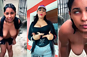Dominicana en pleno aguacero muestra todo al rojo vivo en un barrio